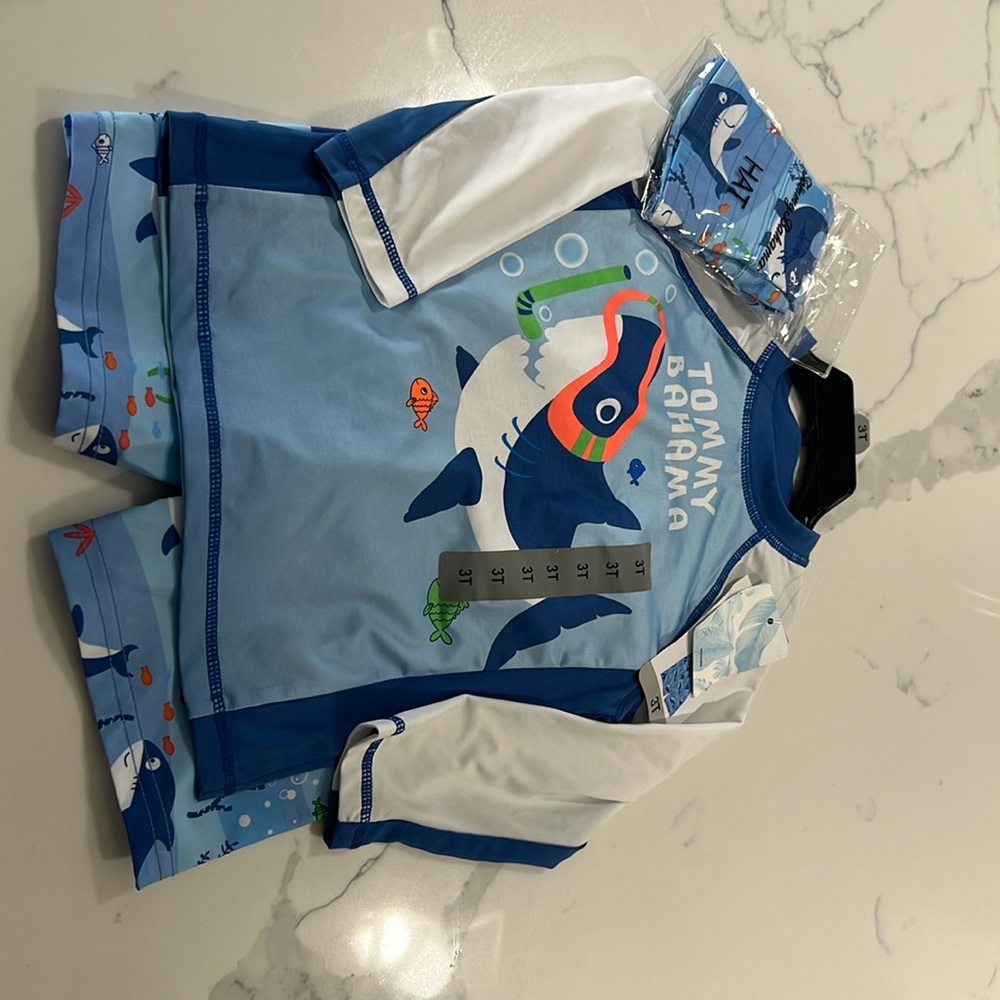 New with tags. 3 piece swim set. Tommy Bahama size 3T.